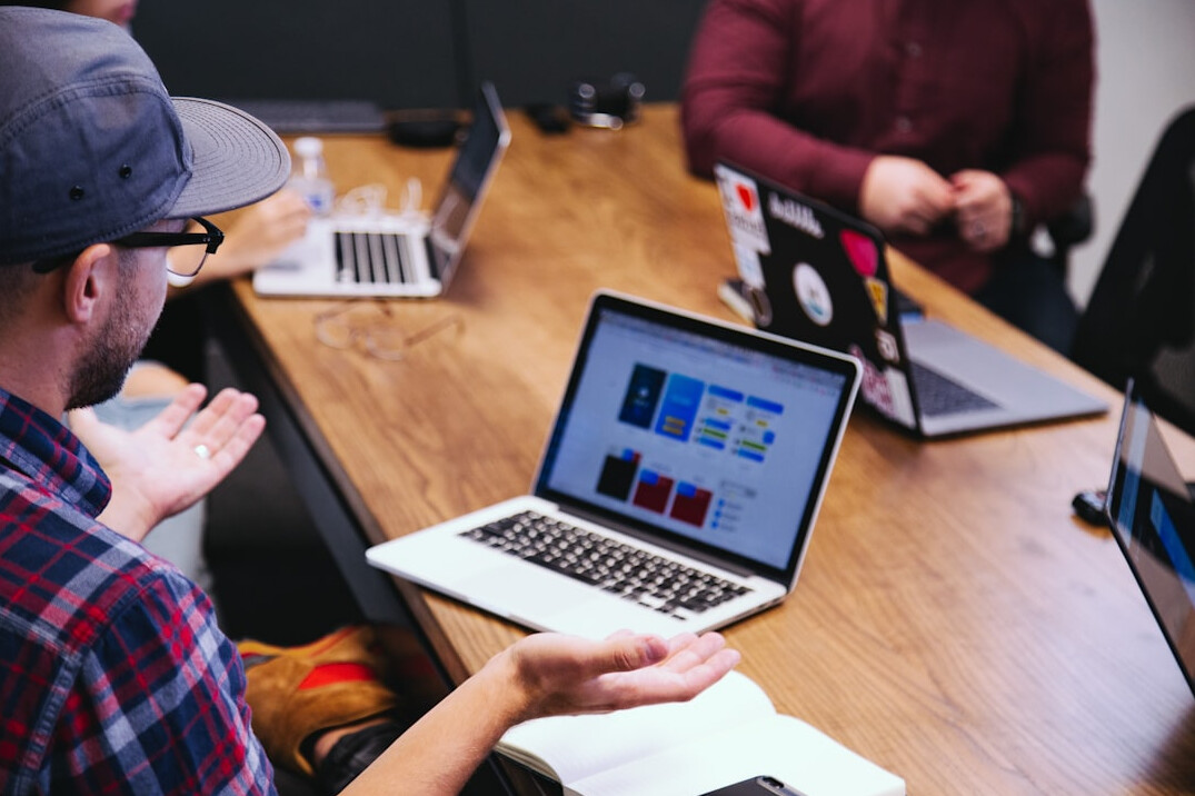 team collaboration on laptop