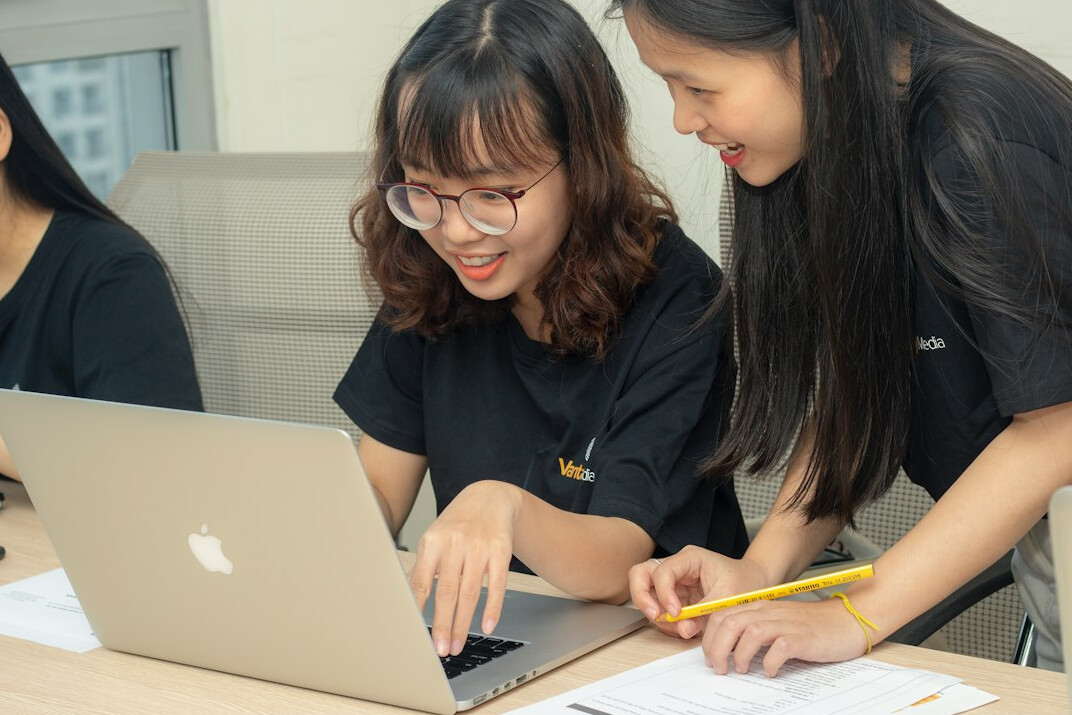 group of students coding together